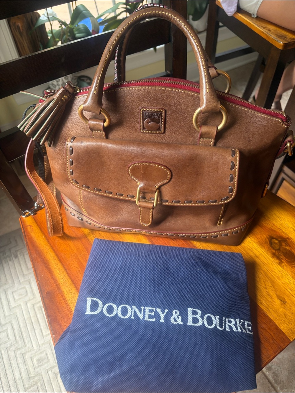 Dooney & Bourke Brown Leather Dome Satchel with Tassel and Front Buckle